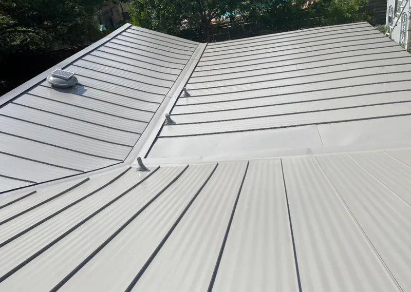 Solar attic fan installed on a metal roof for Roof Ventilation in Wickliffe